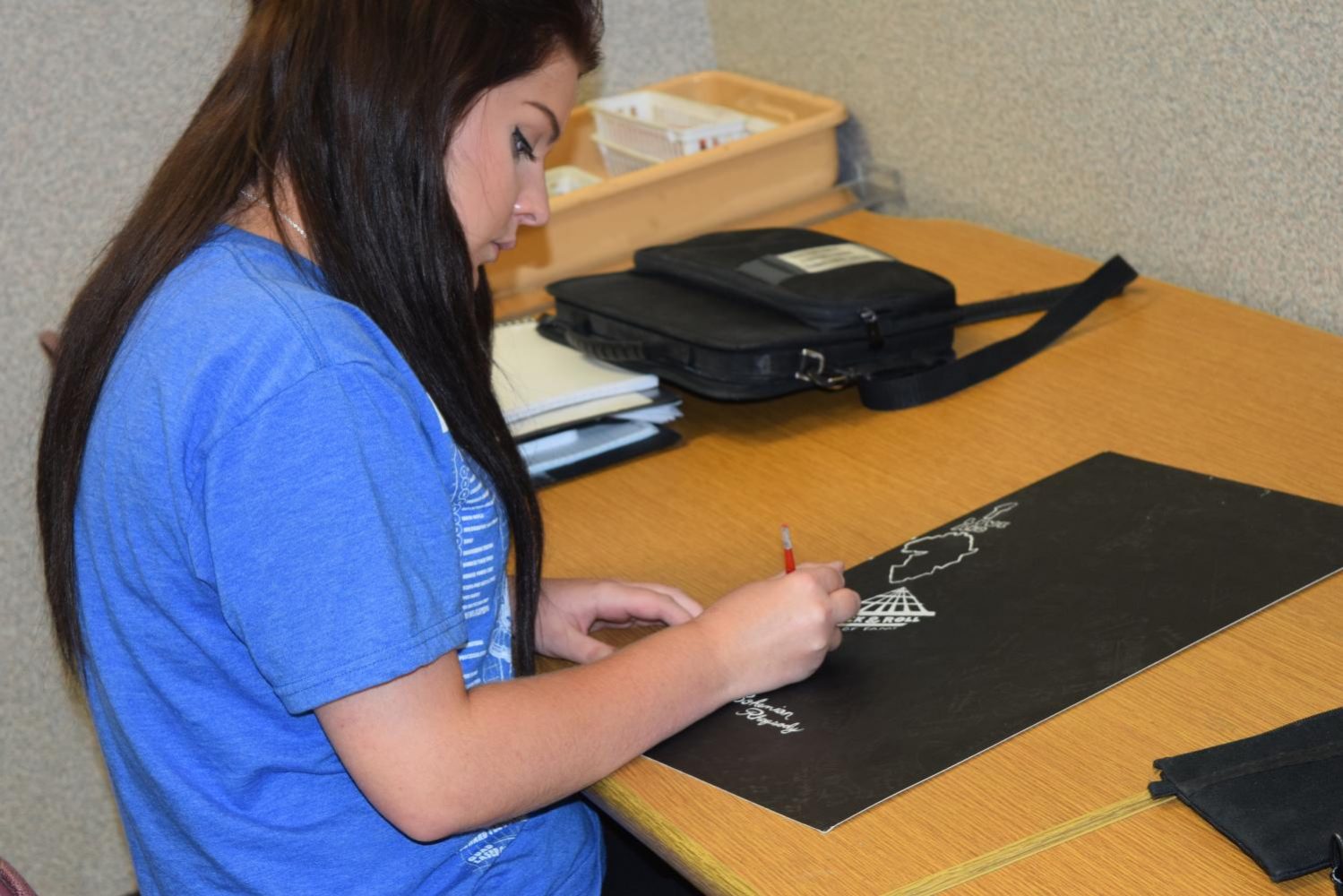 Junior Marissa Spires works on a scratchboard project. 