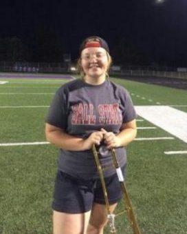 Pictured: Abby Wheeler smiles with many emotions as it is her last evening practice for band. 