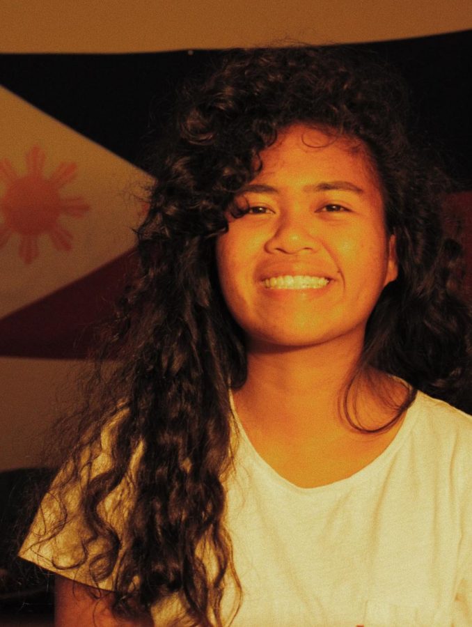 Smiles!: Senior Kyla Lipaopao smiles, as photography is her strong suit. 
