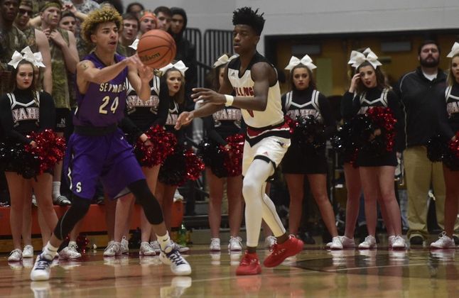 Junior Keaton Seniors passes the ball against New Albany on Friday night. -Photo- Tribune.