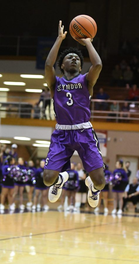 Tribune Photo by Jeff Lubker/ Seymour Eddie Louden shoots the ball on Tuesday during Seymours game against Jennings County at the Seymour Sectional.