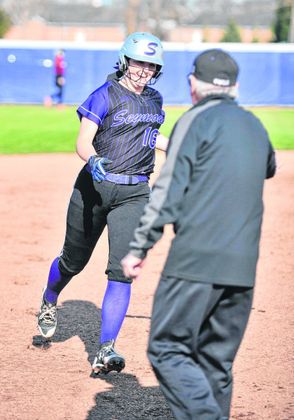 The Tribune- Sophmore Carlee Robinson rounds the bases after hitting a home run. 