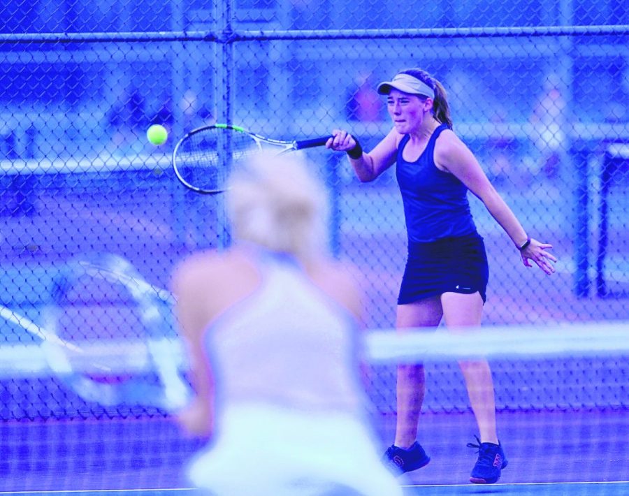 Seymour's Madison Pifer hits a forehand during a sectional match against Scottsburg.