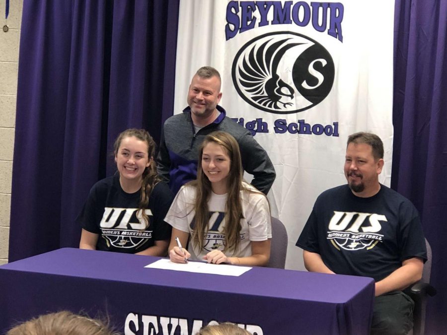 Makenna Fee (middle) with her sister (left), father (right), and Seymour coach Jason Longmeier(top)