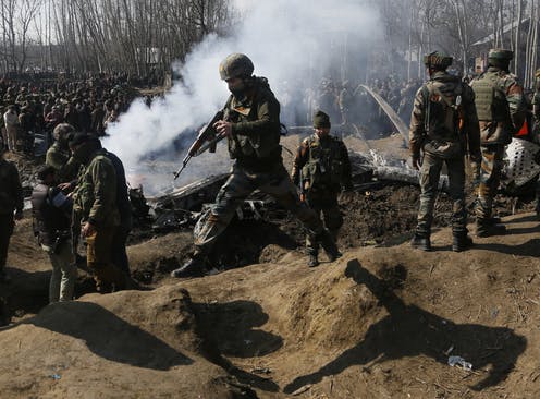 Indian soldiers fighting Pakistani soldiers in Kashmir.