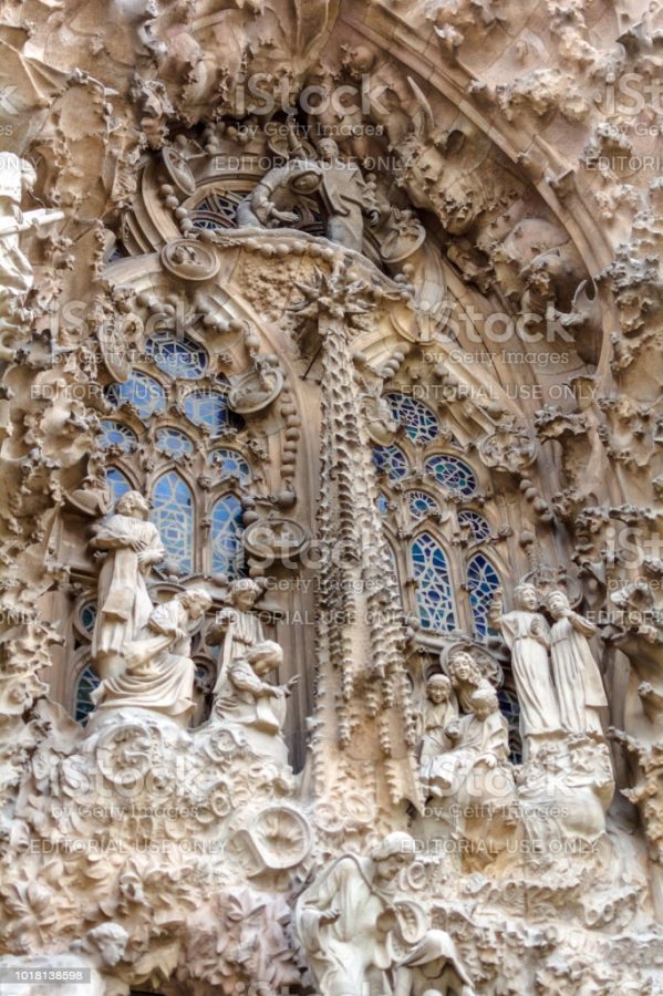Barcelona, Spain - May 9, 2018: Sagrada Familia exterior, Nativity Facade - The Chorus of baby angels celebrating the birth of Jesus and looking over the manger.