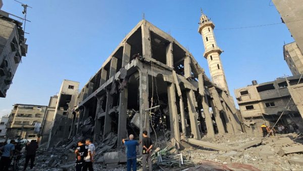 Palestinians gather around the remains of a mosque destroyed in Israeli strikes, as the conflict between Israel and Palestinian Islamist group Hamas continues, in the northern Gaza Strip October 22, 2023. REUTERS/Anas al-Shareef